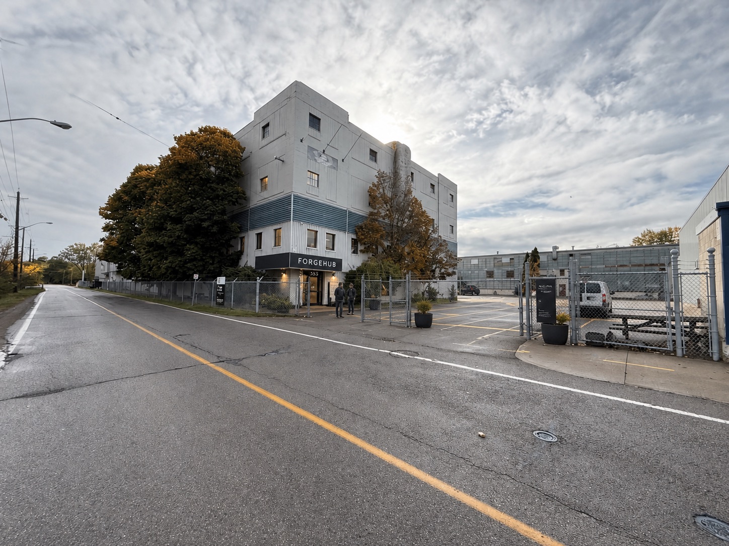 Development-stage visual concept of ForgeHub arrival and building frontage